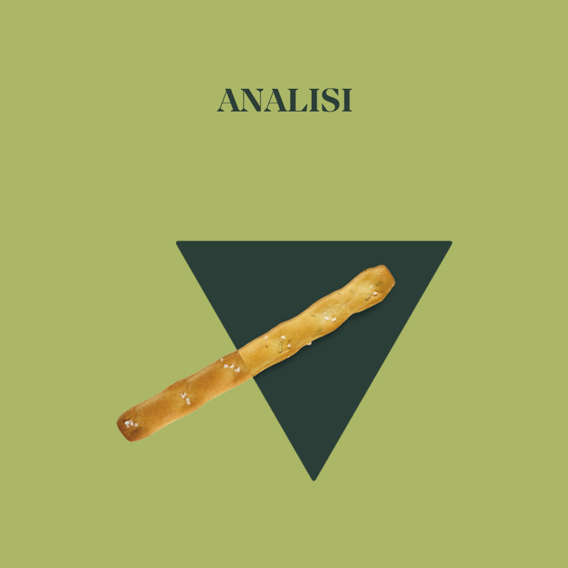 Un'analisi visiva di un bastoncino golden su sfondo verde con triangolo nero