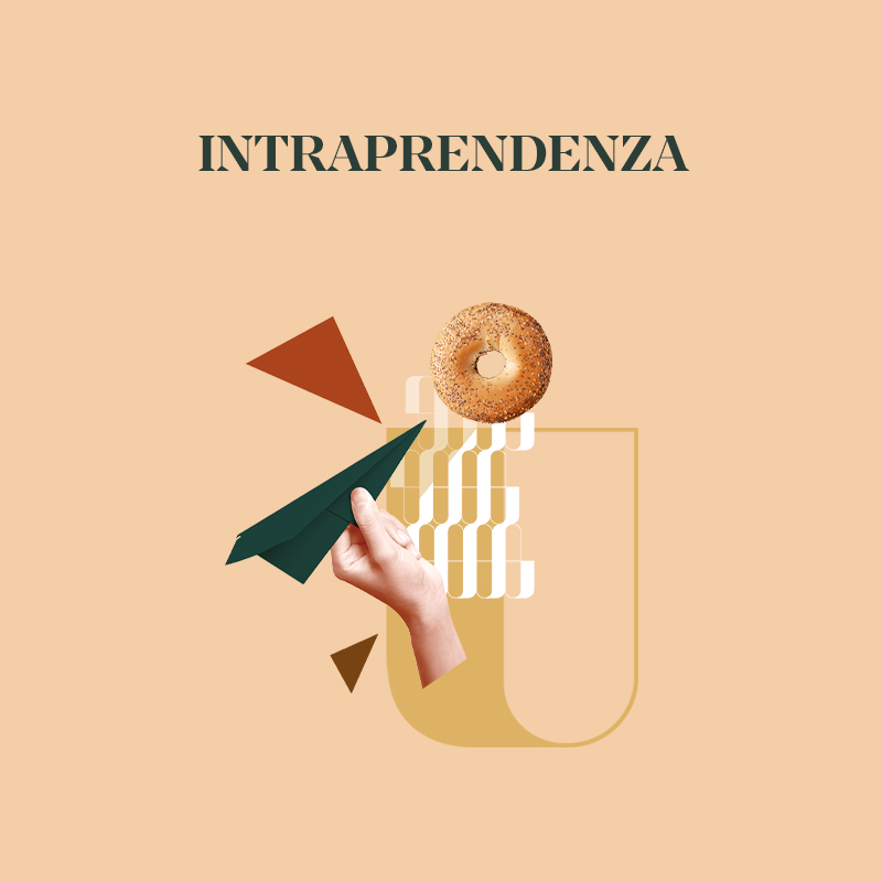 Un'immagine che rappresenta intraprendenza con una mano che lancia un aeroplano di carta e un bagel sullo sfondo